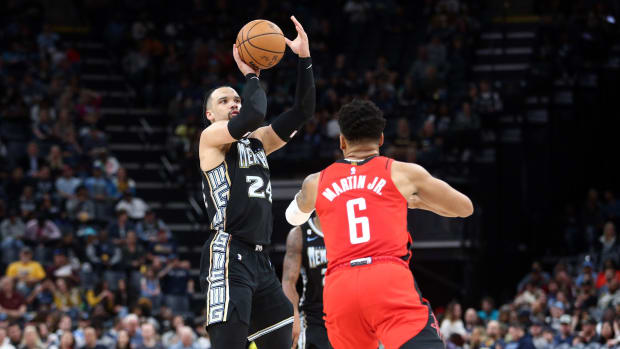 Dillon Brooks shoots over the top of Rockets' K.J. Martin.